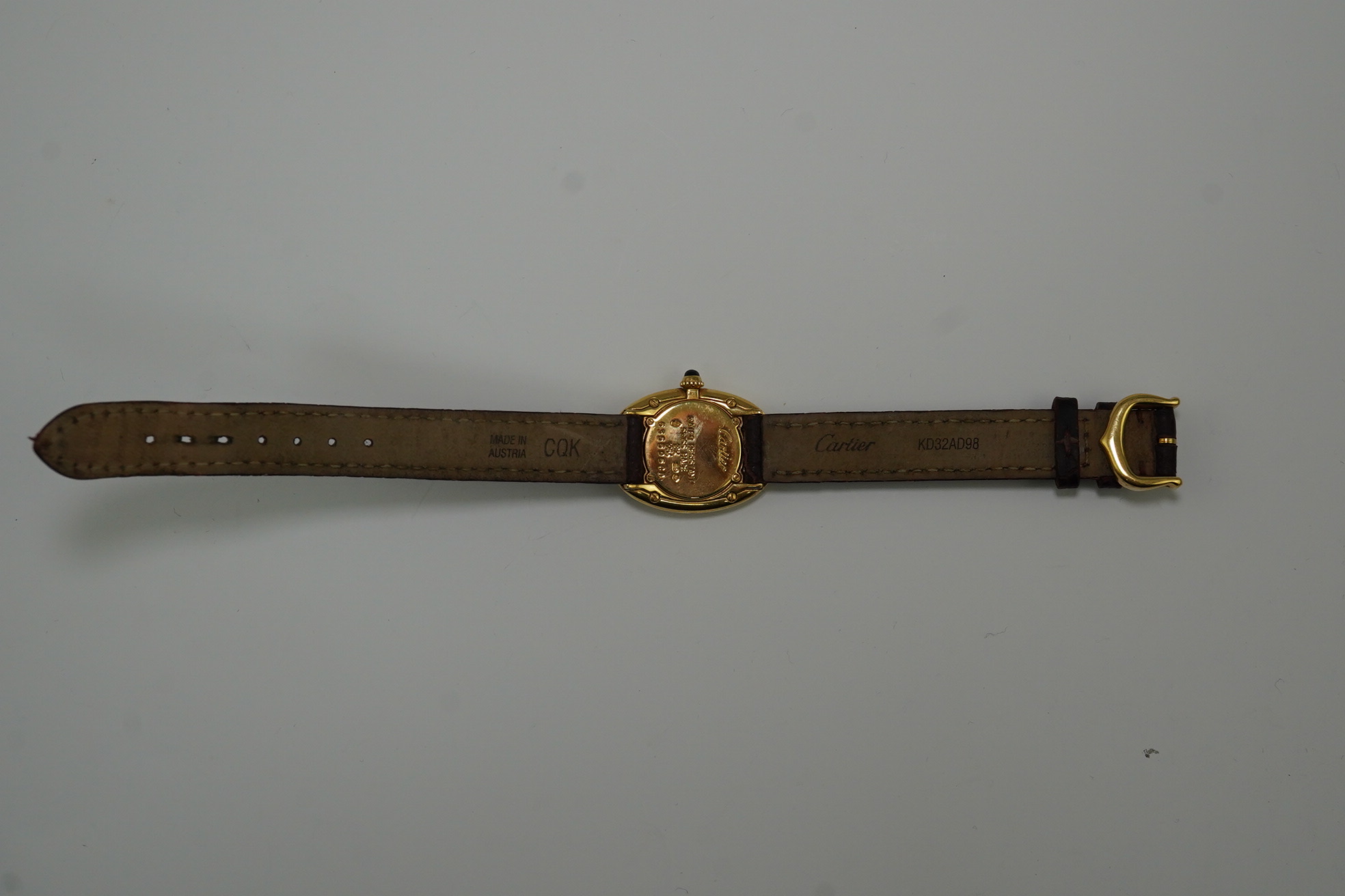 A lady's 2000 18ct gold Cartier Baignoire quartz wrist watch, on a Cartier leather strap